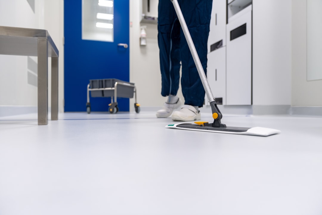services-01 Cleaner cleaning the floor in a laboratory environment